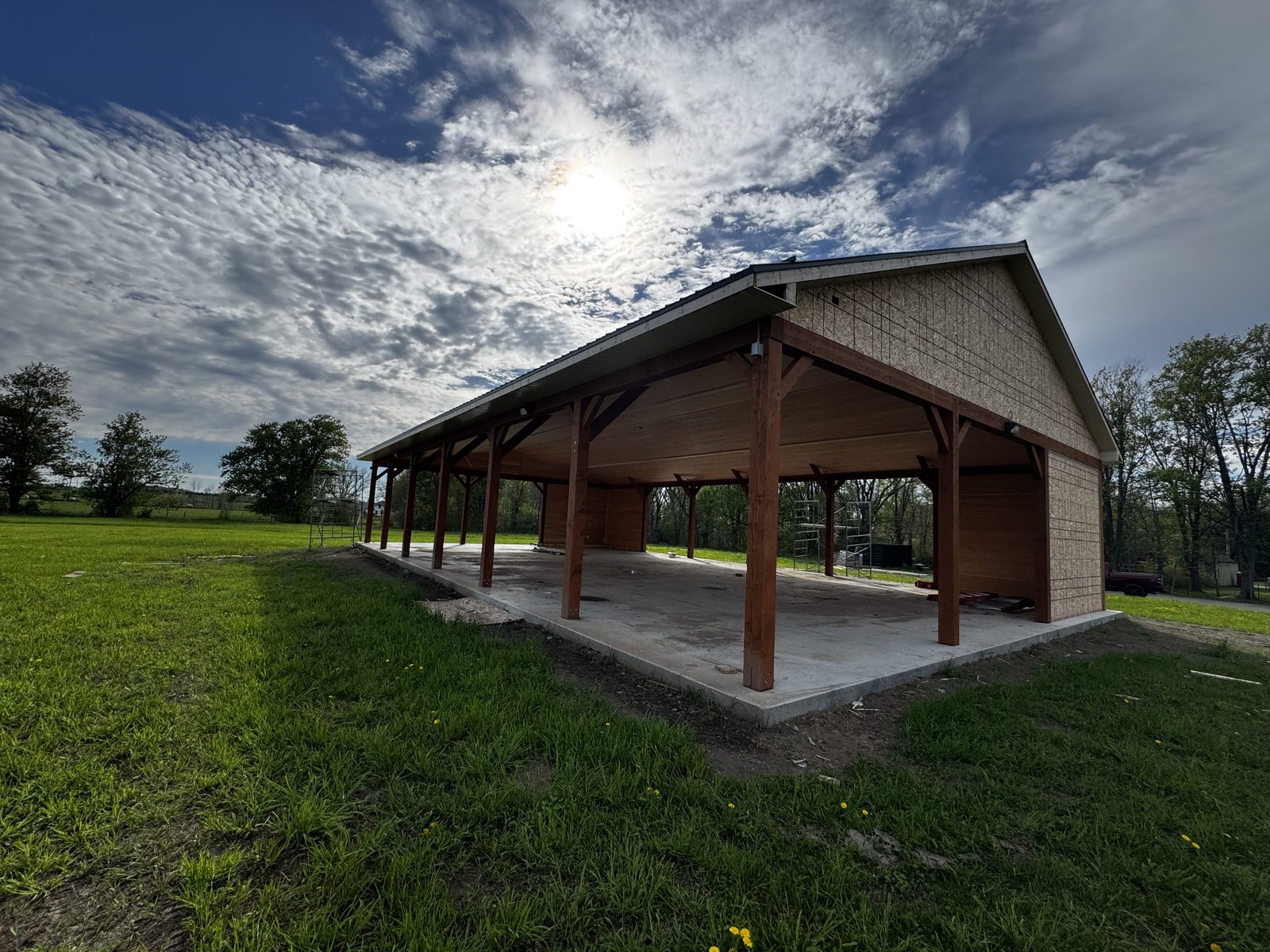 Timber-frame pavilion with a concrete slab on a rural property